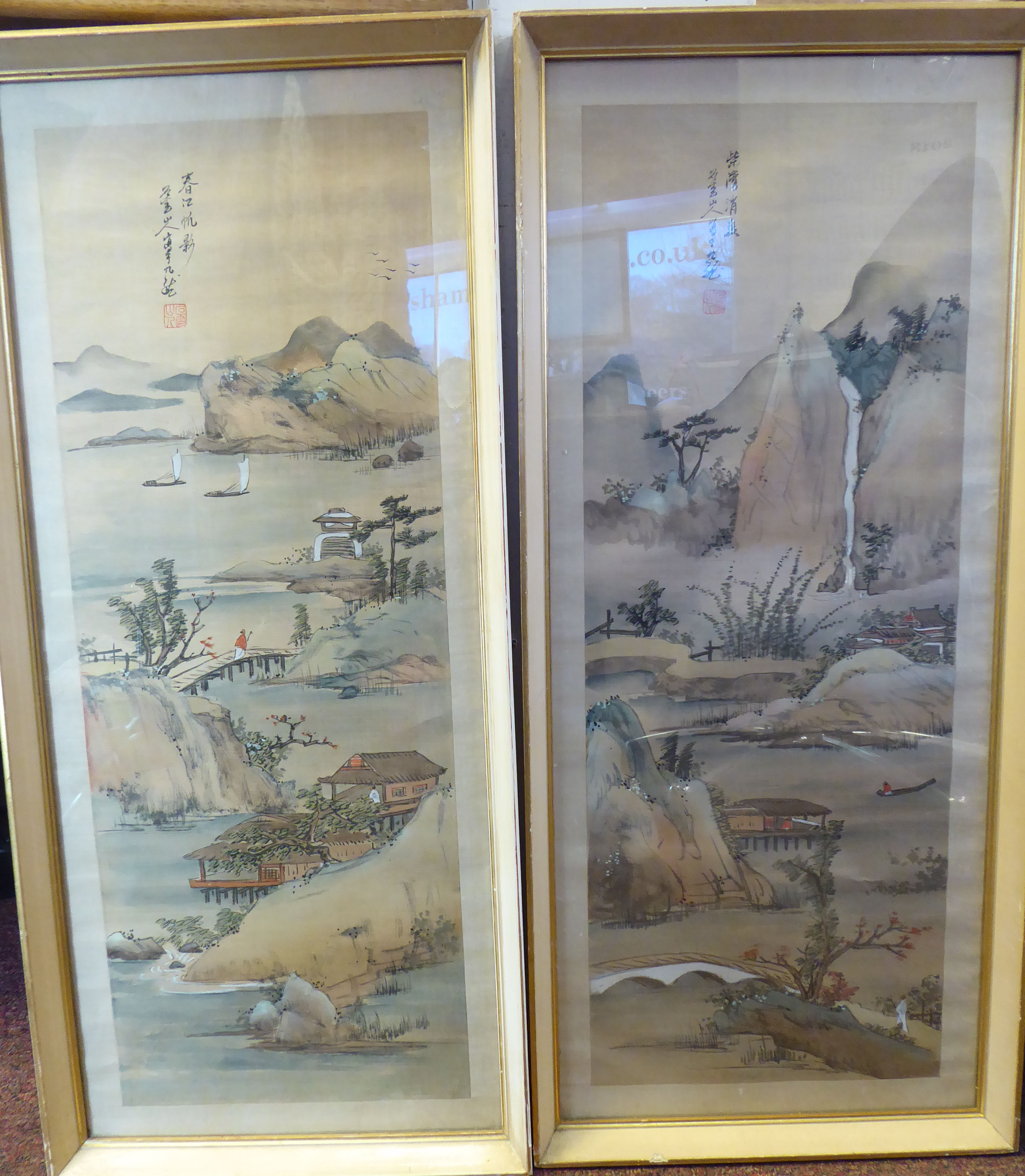 A pair of early 20thC Chinese paintings on silk panels, depicting shoreline scenes with small boats,