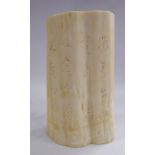 A late 19thC Chinese brush pot, a cross section of an ivory tusk,
