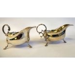 A pair of late Victorian silver sauce boats with flared,