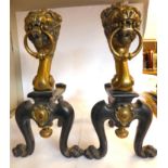 A pair of early 20thC Georgian inspired black painted steel and decoratively cast brass fire dogs