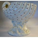 A late 19thC ivory glazed china nautilus shell design spoon warmer,