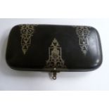 A late 19th/early 20thC folding, cushion moulded black composition cigar case,