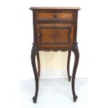 A late 19thC French rosewood bedside cabinet with an inset marble top,