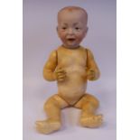 A Kramer & Reinhart bisque head baby doll with painted features, impressed 100 50,