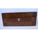 A late 19thC walnut writing box with straight sides and an angled, lockable, hinged lid,