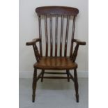 A late 19th/early 20thC stained beech and elm framed Windsor grandfather chair with a curved bar