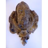 A late 17th/early 18thC moulded plaster plaque, featuring an elderly,