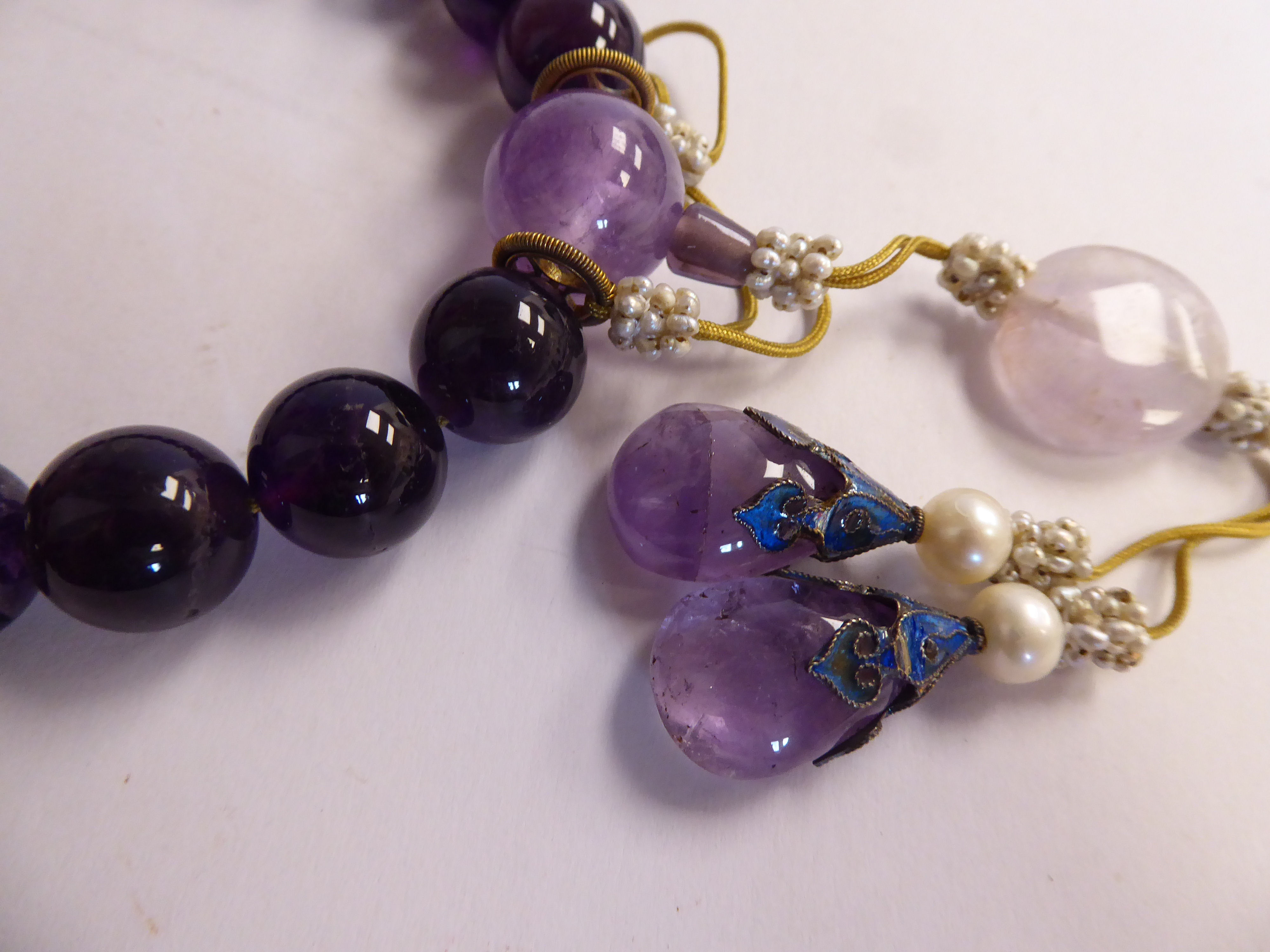 A Chinese amethyst coloured stone and seed pearl bead bracelet with pendants - Image 2 of 2