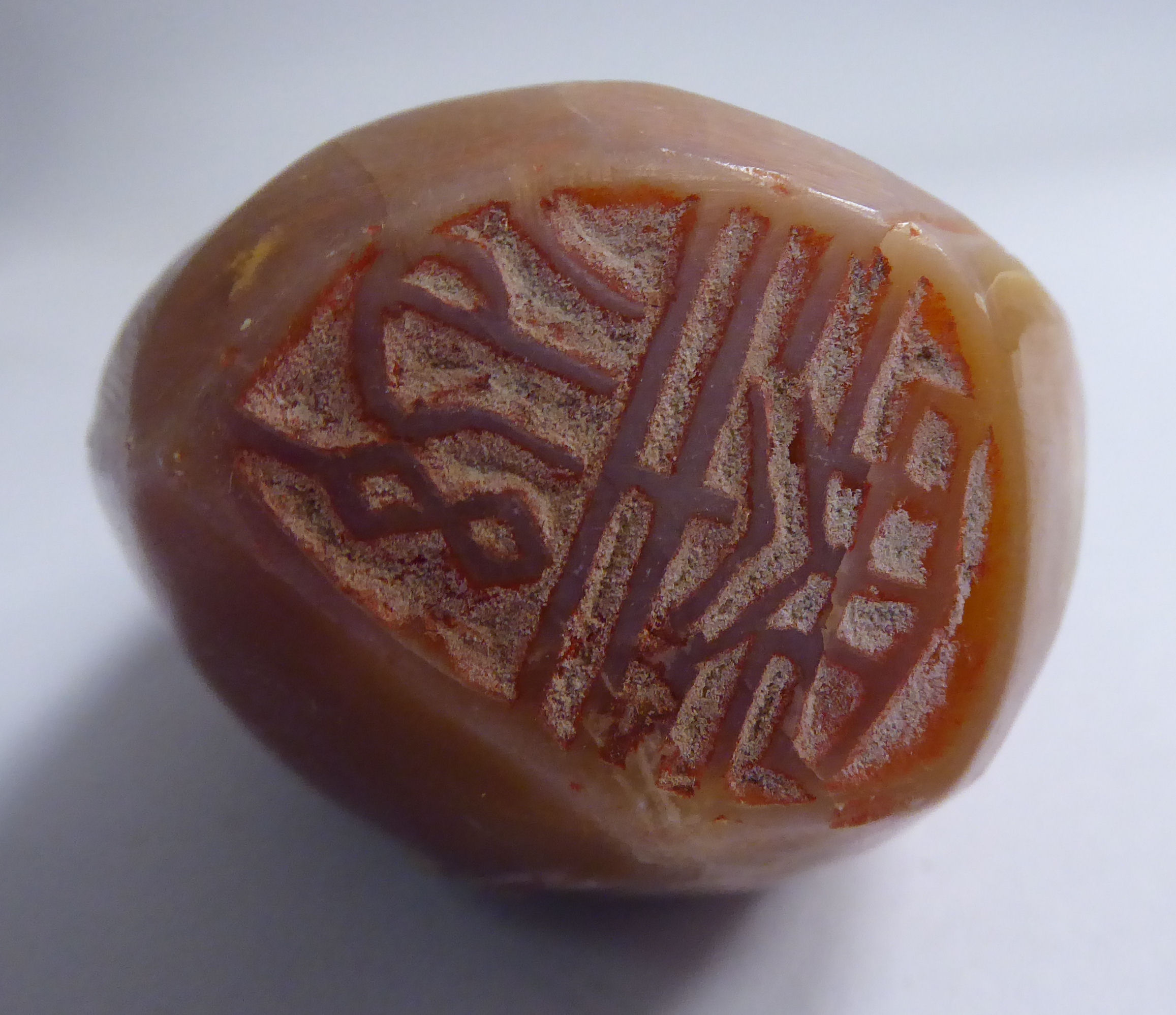 A late 19thC Chinese carved mottled brown soapstone seal of irregular form, - Image 3 of 3
