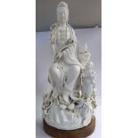 A late 18th/early 19thC Chinese blanc de chine porcelain figure Guan Yin seated,
