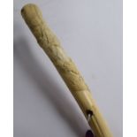 An early 20thC walking cane with a yellow metal ferrule, the rough cut,