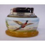 A Minton china oval cased Ronson table lighter, decorated with a pheasant in flight,