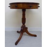 A Regency walnut, mahogany and satinwood drum top pedestal table,