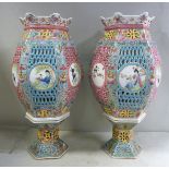 A pair of 20thC Chinese porcelain two part table lamps of pierced hexagonal barrel design,