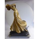 An Art Deco table lamp, featuring a gilded, moulded plaster dancing figure,