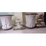 A pair of white painted composition, two part terrace vases,