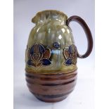 A Royal Doulton brown, green and blue glazed stoneware jug of partially ribbed baluster form,