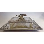 An Art Nouveau star cut glass sardine box with a silver plated tray base,