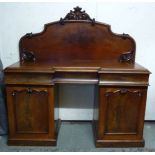 An early Victorian mahogany inverted breakfront sideboard,