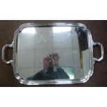 A silver tray with a raised border,