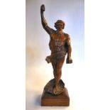 An early 19th Continental carved boxwood figure, a bearded man, one arm held aloft,
