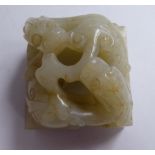 A late 19thC Chinese carved pale green jade square seal, featuring two mythical creatures 1.
