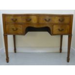 A 1920s Georgian inspired mahogany serpentine front kneehole desk,