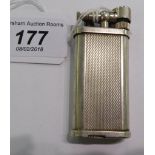 A 'vintage' Dunhill Unique silver coloured metal cased butane filled cigarette lighter 11