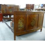 A 1930s/50s mahogany bedhead and foot, the triple panelled headboard,