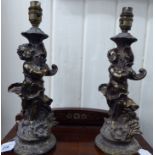 A pair of mid 20thC cast, lacquered brass table lamps,