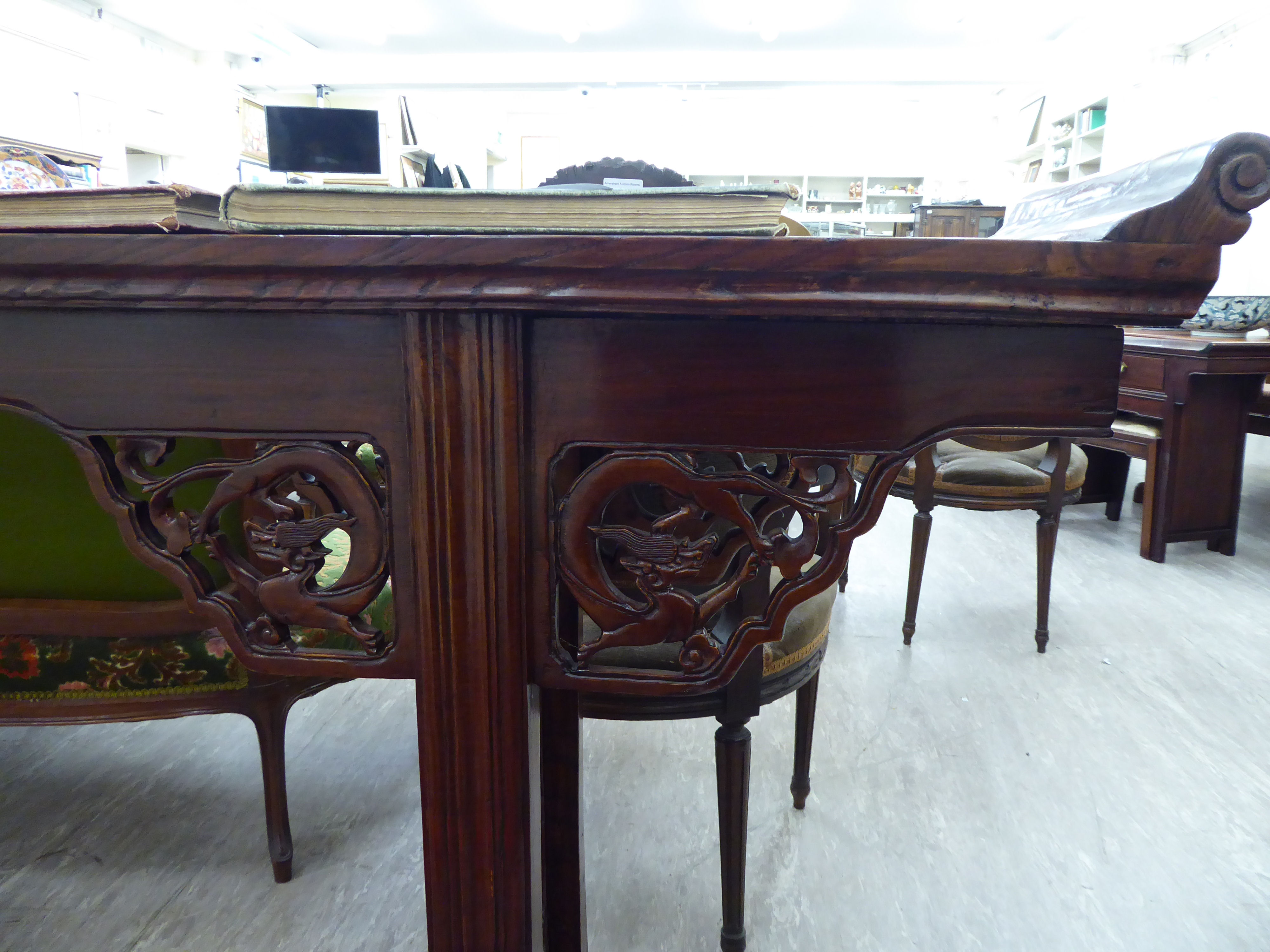 A modern Chinese lacquered elm altar table, the top with raised ends, over a carved apron, - Image 2 of 2