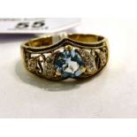 A 9ct gold ring, set with a heart shaped topaz,