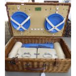 A Coracle wicker picnic hamper with glass and plastic receptacles 6.