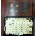 A modern Mah-Jong set with bone and bamboo tiles, in a hardwood box,