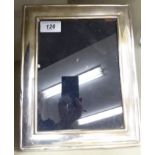 A glazed, cushion moulded silver photograph frame,