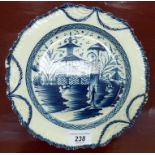 A late 18thC English Pearlware plate, decorated in blue and white,