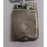 An Everest silver coloured metal cased cigarette lighter with engine turned decoration stamped 925