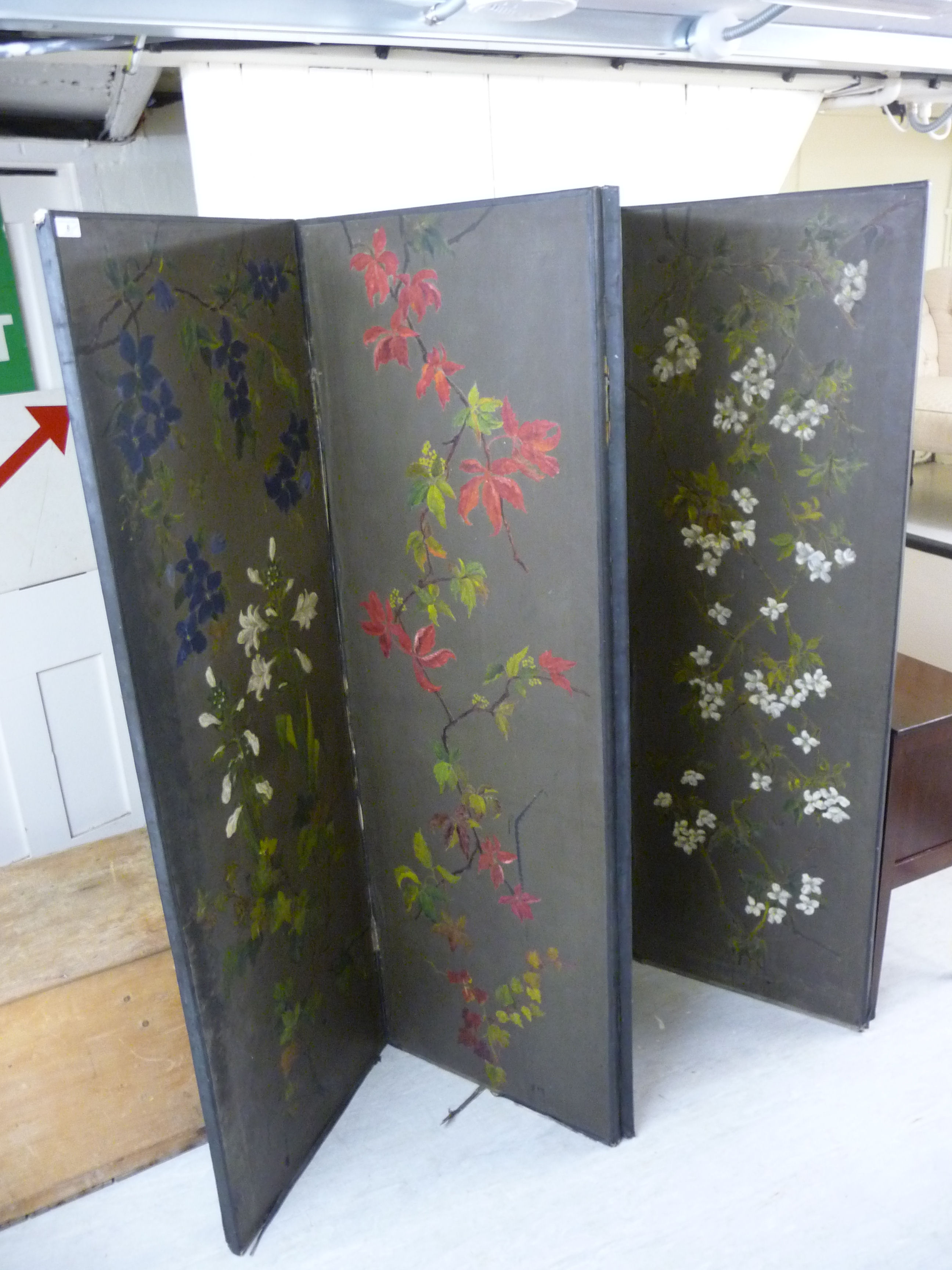 An early 20thC Japanese inspired canvas covered, four-fold room screen,