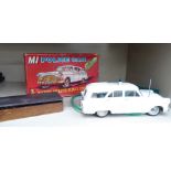 A 1960s Louis Marx Toys 'M1 Police Car' with a battery operated remote control,