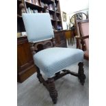An early 20thC Colonial carved oak showwood framed hall chair,
