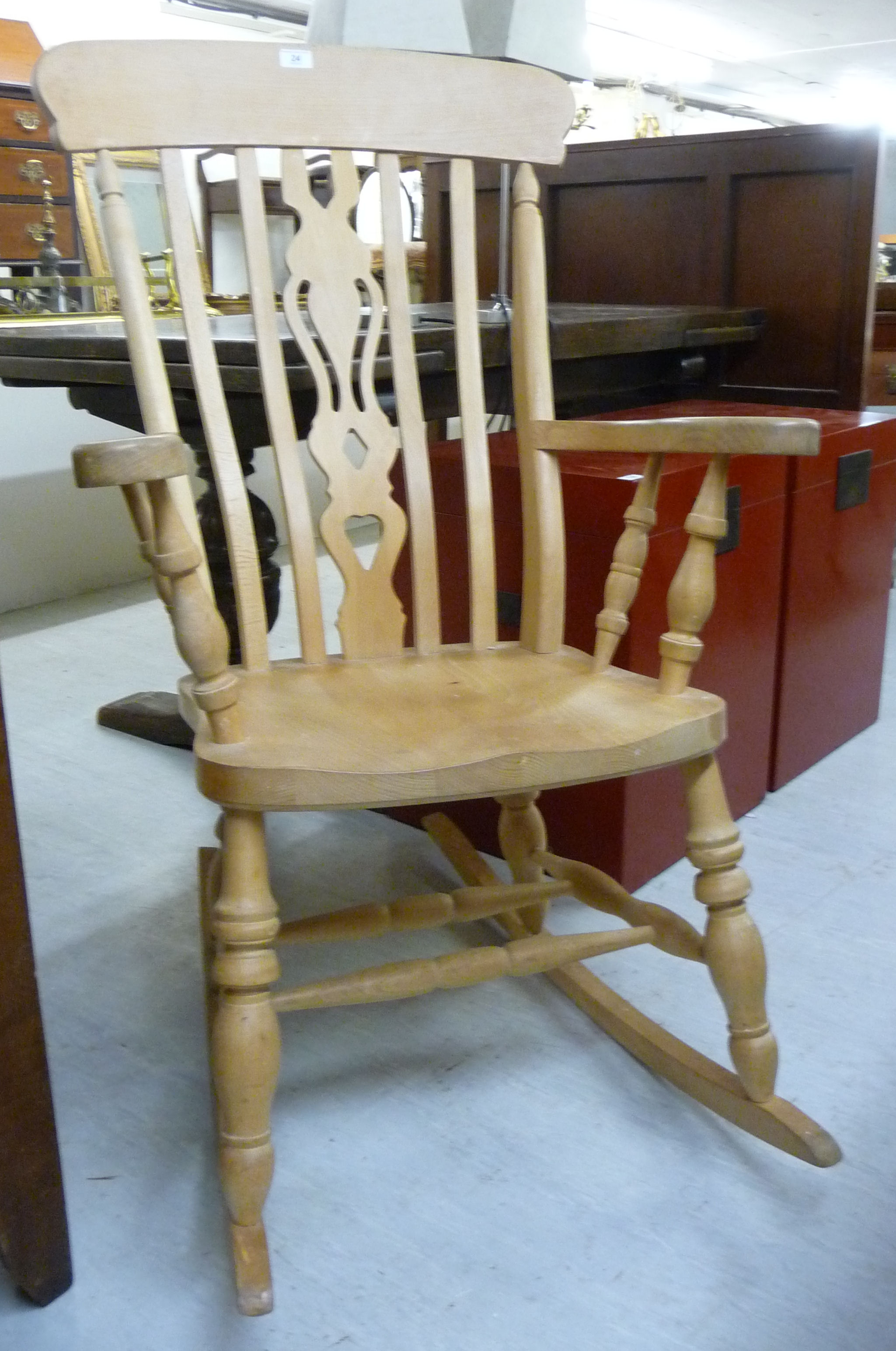 A modern bleached beech framed Windsor rocking grandfather chair with a high lath back,