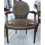 A modern French inspired carved, stained beech, showwood framed salon chair,