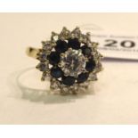 A 9ct gold claw set sapphire and cubic zirconia cluster ring 11