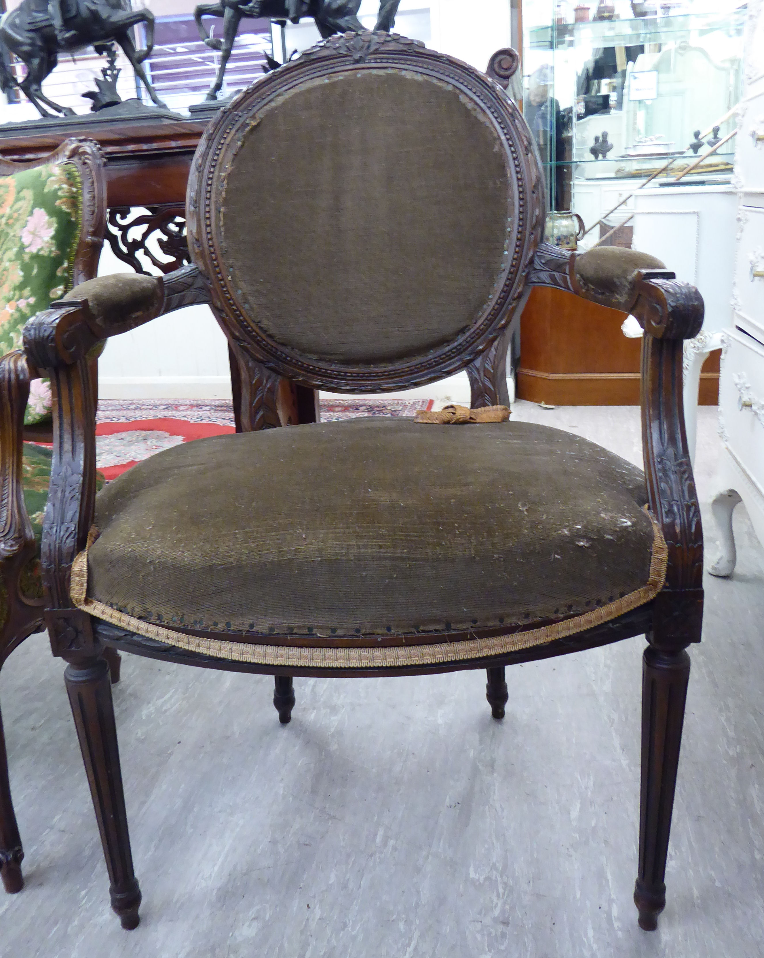A modern French inspired carved stained beech showwood framed salon chair,