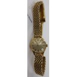 A ladies 9ct gold Omega bracelet watch with a textured strap,