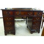 A modern mahogany finished eight drawer twin pedestal desk,