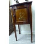 A 1930s/50s Japanese inspired mahogany and gilded bow front bedside cupboard with a single panelled