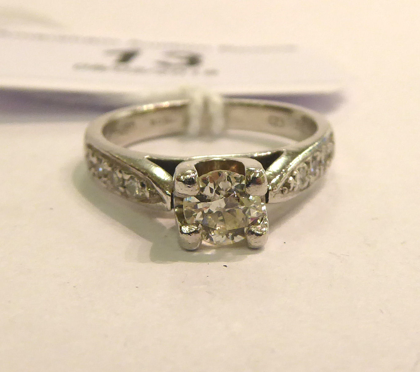 A platinum and diamond set solitaire ring 11