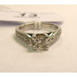 A platinum and diamond set solitaire ring 11