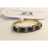 A 9ct gold five stone sapphire and diamond set half eternity ring 11